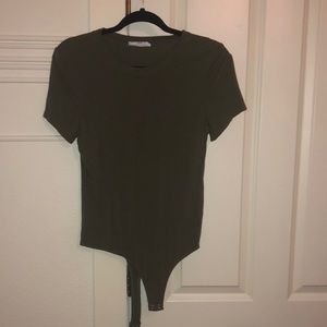 This body suit is an army green. It is a size small. Fits tightly. Size small.